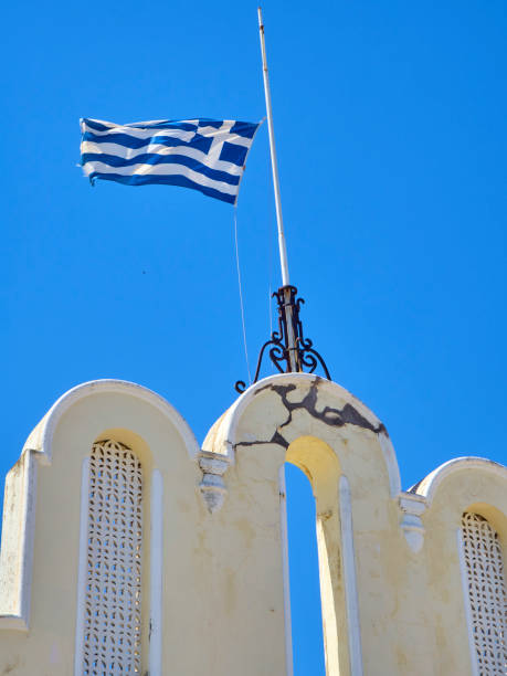 istock Flag of Greece waving on a blue sky. 1006550054