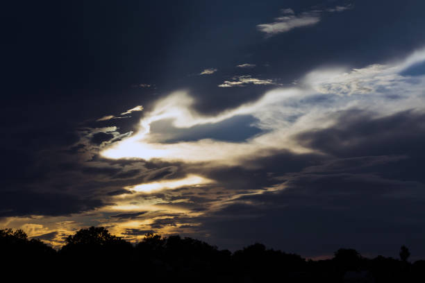 istock clouds in the sky at sunset, illuminated by the sun's rays 1006550312