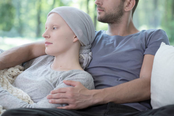 istock Husband hugging his wife with cancer 1006556048