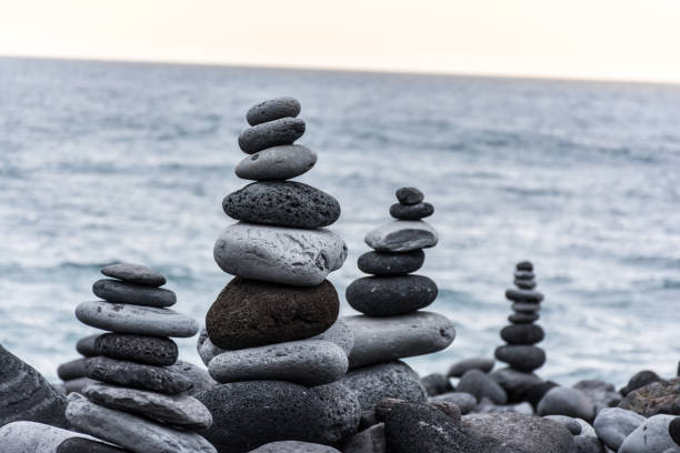 istock Volcanic rocks placed in pyramid mode, for enjoyment and relaxation. This unique place is located in the port of La Cruz in Tenerife (Spain) 1006556618