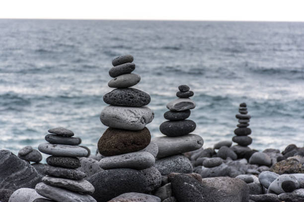 istock Volcanic rocks placed in pyramid mode, for enjoyment and relaxation. This unique place is located in the port of La Cruz in Tenerife (Spain) 1006558828