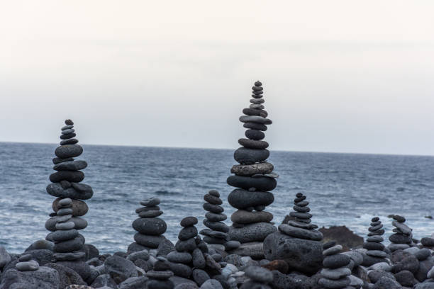 istock Volcanic rocks placed in pyramid mode, for enjoyment and relaxation. This unique place is located in the port of La Cruz in Tenerife (Spain) 1006558934