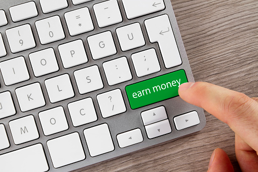 Earn Money concept with computer keyboard