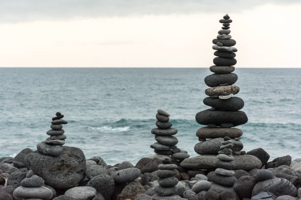 istock Volcanic rocks placed in pyramid mode, for enjoyment and relaxation. This unique place is located in the port of La Cruz in Tenerife (Spain) 1006559356