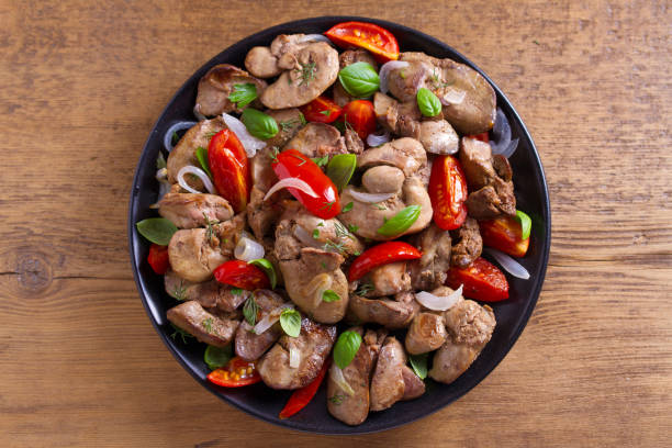 istock Chicken liver with plum cherry tomatoes, onion and basil 1006563868