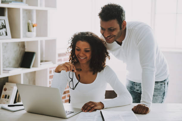 istock Pakistani Freelancer with Wife Working at Home. 1006566844