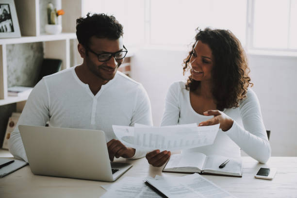 istock Pakistani Freelancer with Wife Working at Home. 1006566876