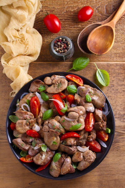 istock Chicken liver with plum cherry tomatoes, onion and basil 1006566930