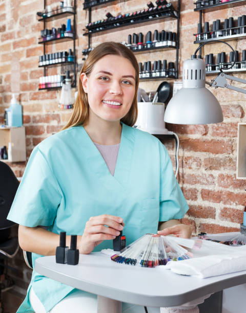 istock Manicure girl working with female client 1006574970