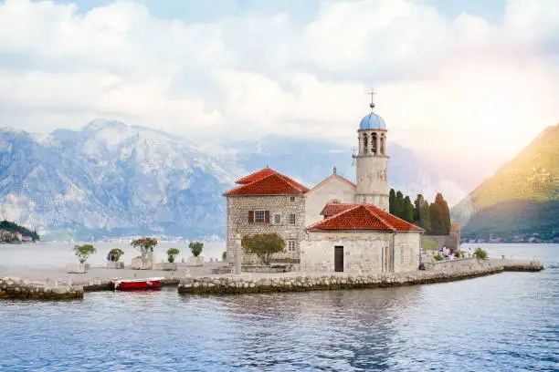 Our Lady of the Rock and St.George Island in Perast on shore of Boka Kotor bay, Adriatic Sea, Montenegro. Picturesque sea and mountain scenery