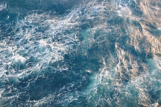 istock Surface of sea water. Blue cold frothy wavy aqua background. Open deep sea, view from above. 1006578408