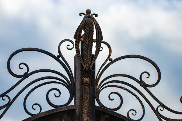 istock wrought-iron gates, ornamental forging, forged elements close-up 1006582112