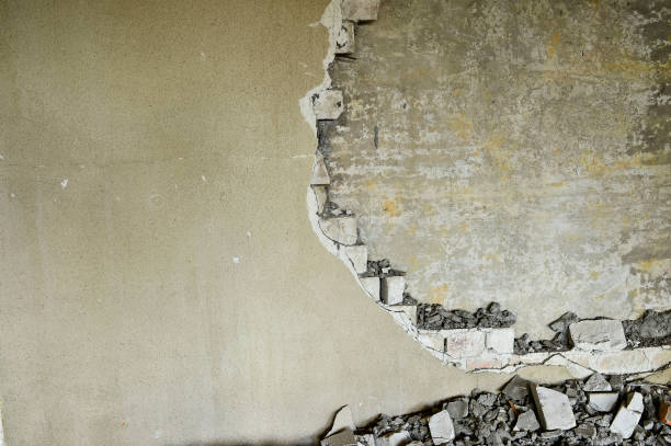 istock Partially destroyed wall inside an industrial building under demolition 1006587968