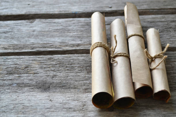 istock Rolls of paper tied with a rope. Free space for text . 1006594268