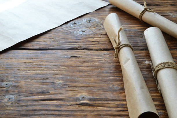 istock Rolls of paper tied with a rope. Free space for text . 1006594448