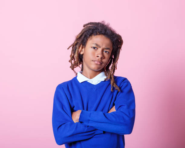 Afro american school boy staring at camera