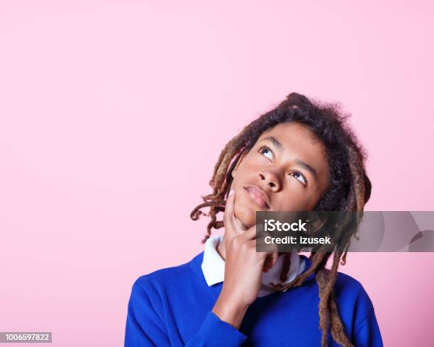 Thoughtful Schoolboy Looking Up Stock Photo - Download Image Now - Contemplation, Teenager, Child