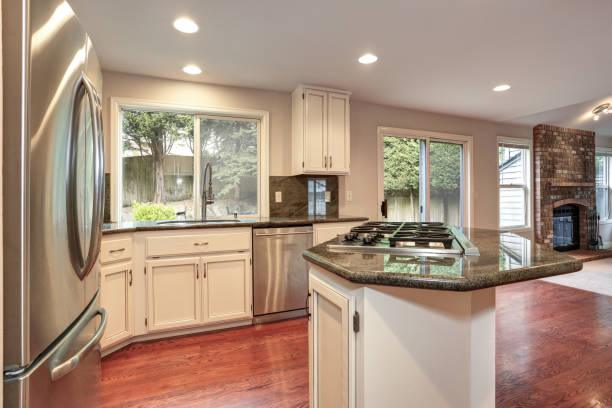 istock White kitchen room with stainless steel appliances. 1006598056