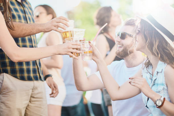 istock Couple sitting outdoor party 1006598388