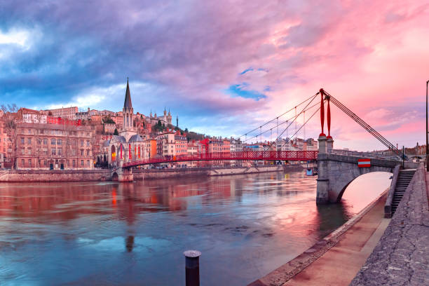 Old town of Lyon at gorgeous sunset, France Saint Georges church and footbridge across Saone river, Old town with Fourviere cathedral at gorgeous sunset in Lyon, France lyon photos stock pictures, royalty-free photos & images