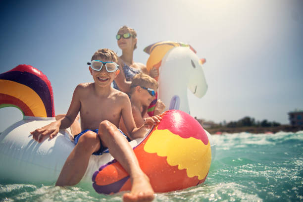 istock Kids enjoying beach and sea vacations 1006606778