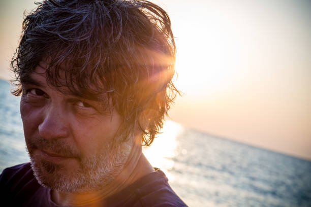 istock Portrait of handsome middle aged man looking at camera 1006607680