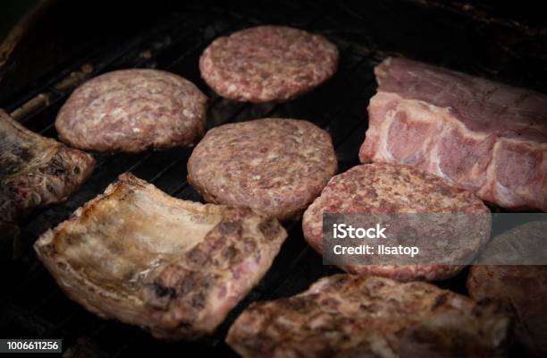 Ribs And Hamburgers Stock Photo - Download Image Now - Barbecue - Meal, Barbecue Grill, Beef