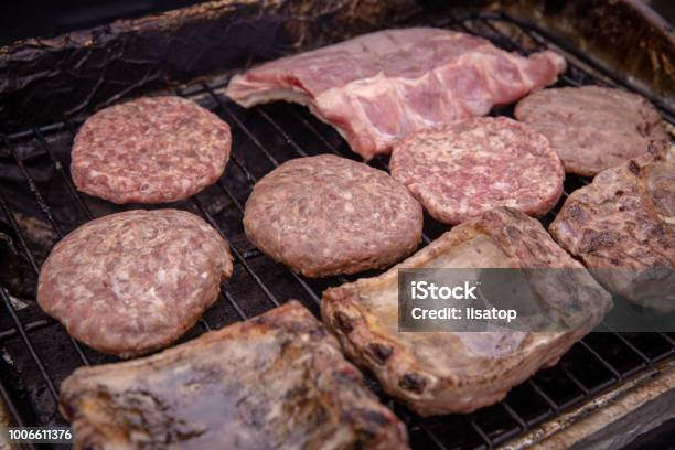 Barbecuing Meats On The Grill Stock Photo - Download Image Now - Barbecue - Meal, Barbecue Grill, Beef