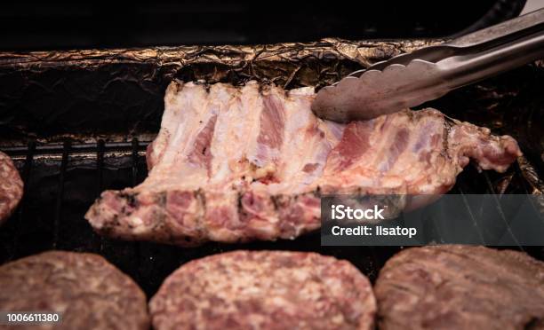 Flipping The Ribs Over Stock Photo - Download Image Now - Barbecue - Meal, Barbecue Grill, Beef