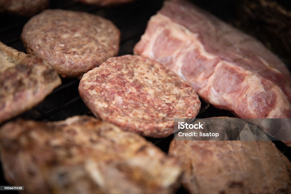 Close up of barbeque meats Close up of barbeque meats. Ribs and burgers Barbecue - Meal Stock Photo