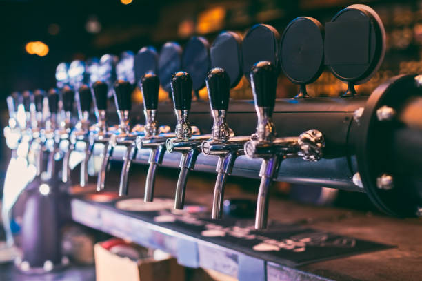 istock Beer tap row. Beer tap in the bar. 1006623448