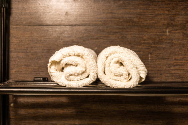istock roll cotton towels on shelves 1006623476