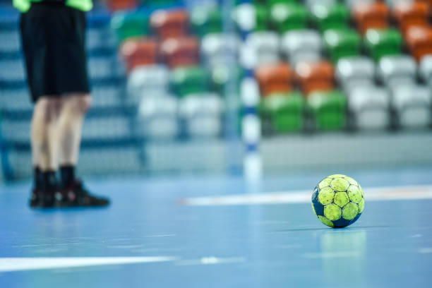 istock handball ball and legs of referee 1006629484