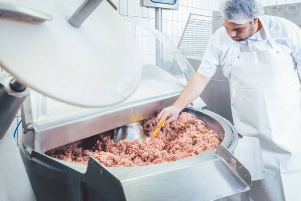 istock Butcher checking minced meat for the right quality 1006629640