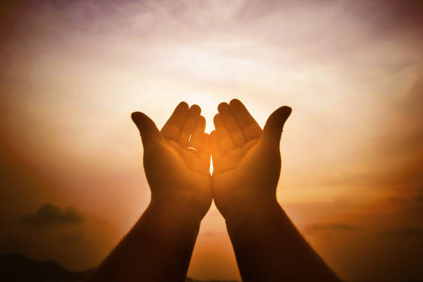 istock Christian man with open hands worship christian. Eucharist Therapy Bless God Helping Repent Catholic Easter Lent Mind Pray. Christian concept background. 1006629796