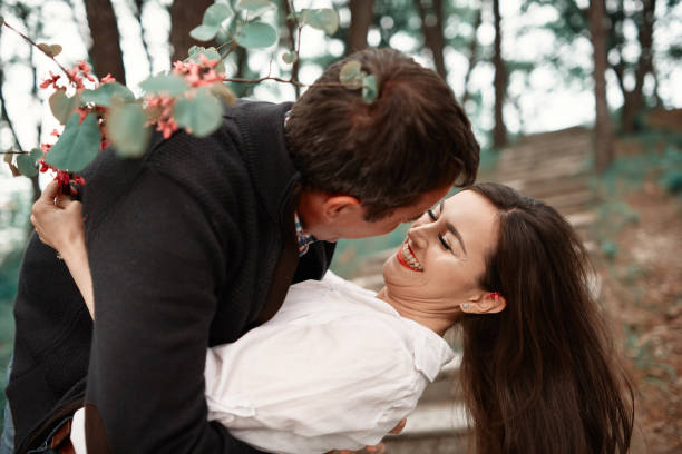 istock romantic couple in the park 1006633358