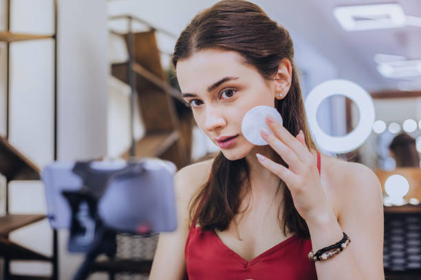 istock Beautiful professional makeup artist filming master class 1006634324