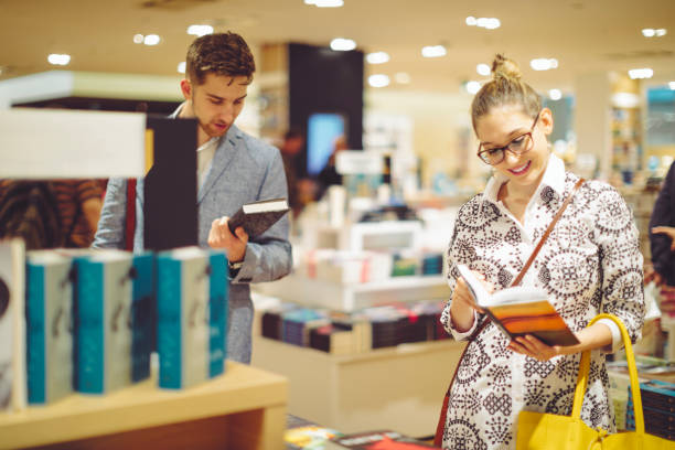 istock Young couple shopping books 1006641072