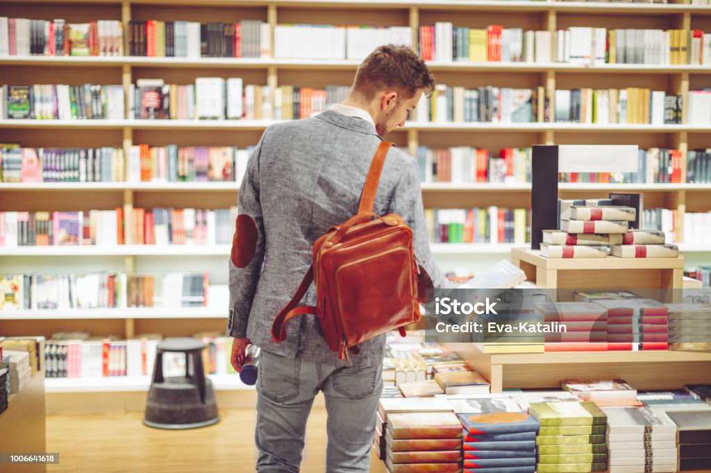 Young man shopping books Bookstore Stock Photo