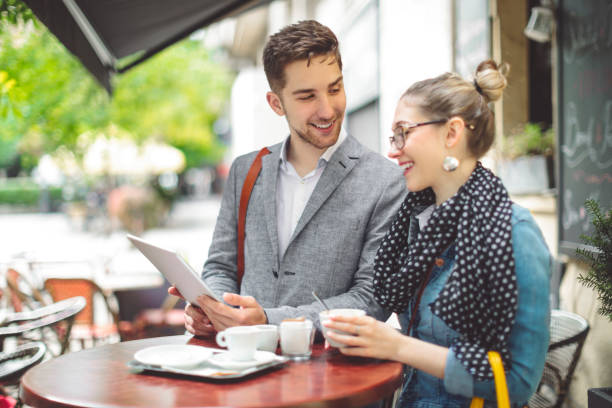 istock Young couple in a coffee shop 1006642280