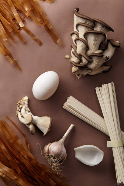 istock Asian cuisine ingredients on brown background. Monochromatic concept 1006645618