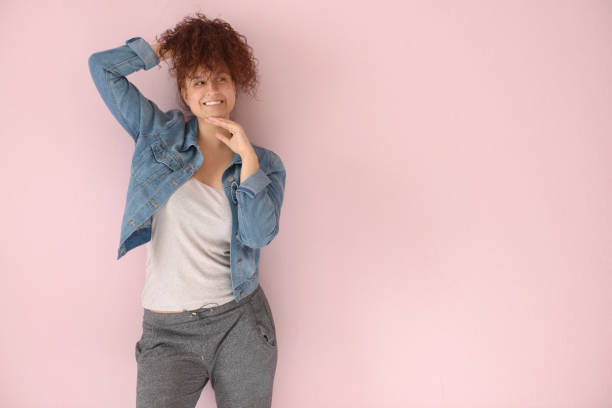 istock Beautiful girl on the pink background 1006648110