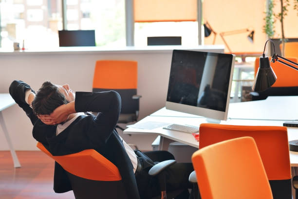 istock Happy young business man work in modern office on computer 1006648120
