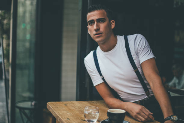 istock Man drinking coffee in coffee shop 1006652342