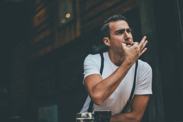istock Handsome man whistling in coffee shop 1006652596