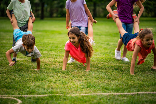 istock Group of kids playing in park 1006653186
