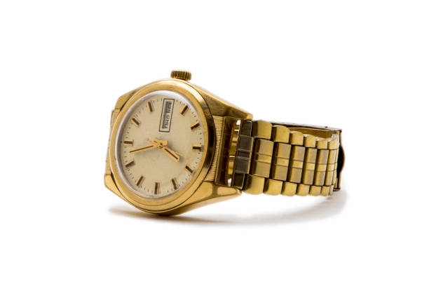 istock Wrist watch in gold isolated on white background 1006658138