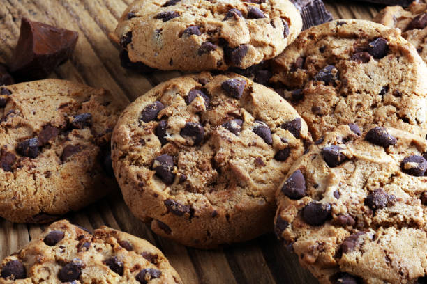 istock Chocolate cookies on table. Chocolate chip cookies shot with chocolate 1006669184