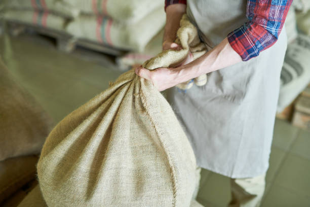 istock Roaster Carrying Coffee Bags 1006669560