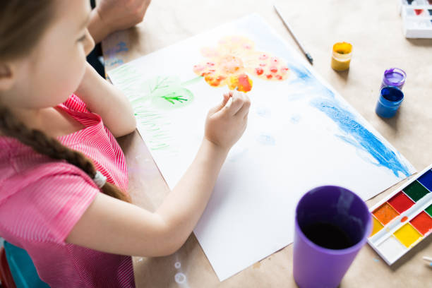 istock Girl drawing at the table 1006670442